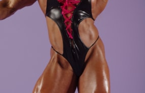 Blonde babe Lisa Cross posing in bodysuit